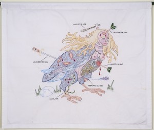 Dense hand embroidery on vintage textile, 28" x 33". A bird's body with a woman's head displays large graphic wounds and the instruments that made them --- arrows, swords, clubs, etc. The wounds are dated and could refer to incidents my life.