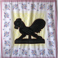 From the series American Memento Mori: Rooster - applique and embroidery on vintage textile. A folk art weathervane of a rooster in silhouette with a skeleton head is appliquéd onto a colorful vintage tablecloth, and embellished with white embroidery.