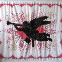 From the series American Memento Mori: Angel - applique and embroidery on vintage textile. A folk art weathervane of an angel in silhouette with a skeleton head is appliquéd onto a colorful vintage tablecloth, and embellished with white embroidery.