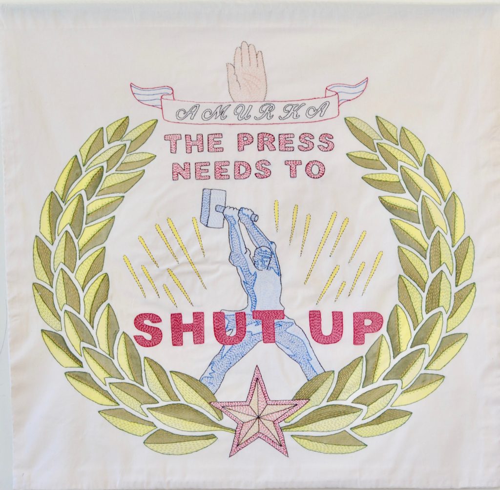 Needling the Regime: Press/35" x 36"/hand-embroidery on textile
